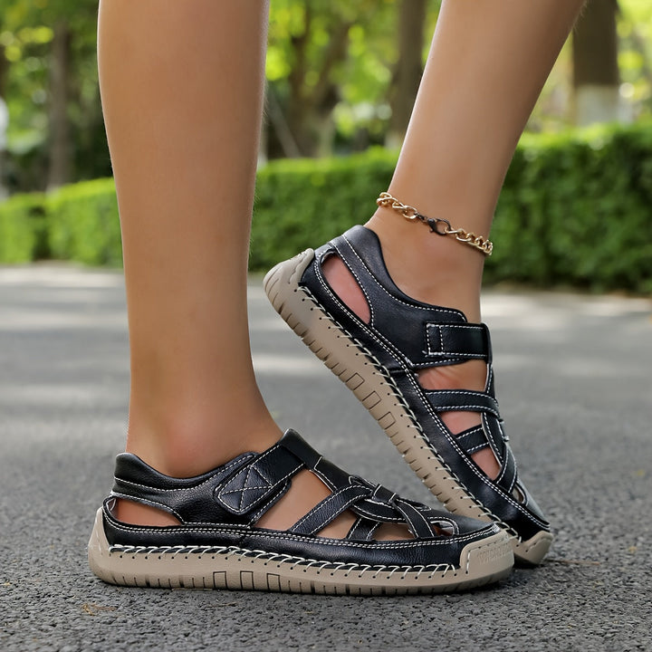 Navy cross-strap comfort flat sandals with ankle strap and cushioned sole