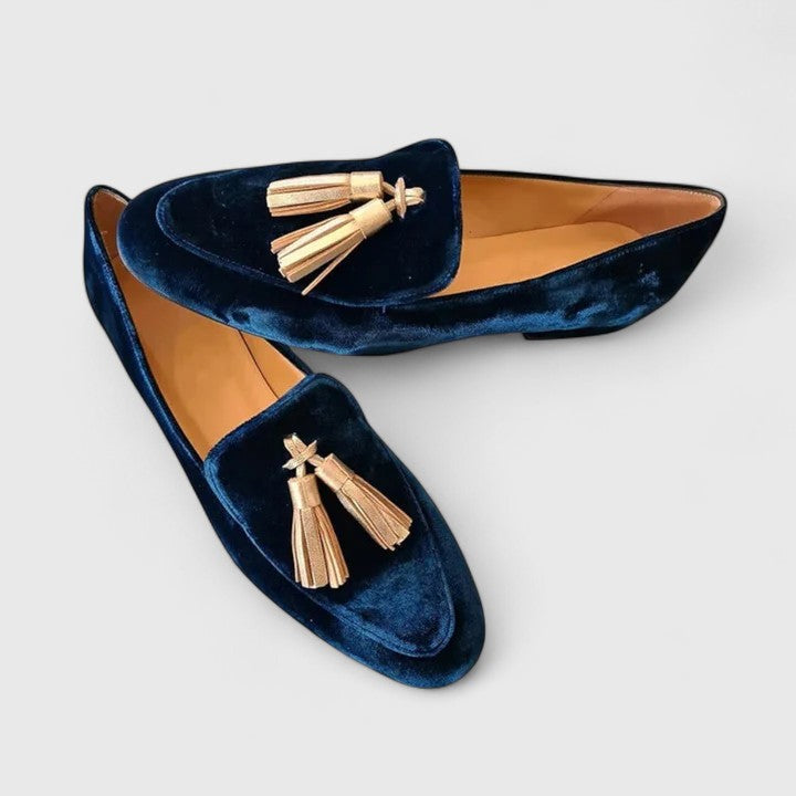 Blue velvet slip-on flats with tassel detail and pointed toe