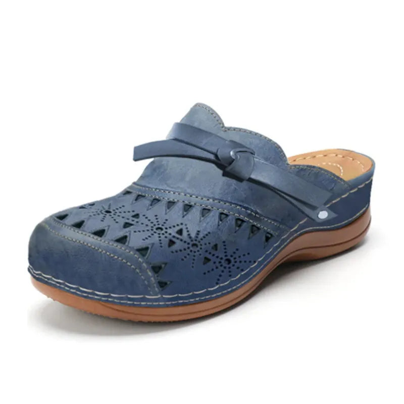 Navy cutout slip-on clogs for women with side slingback and perforated pattern