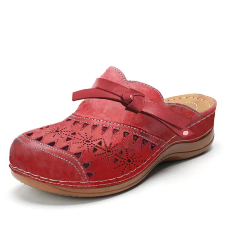 Red cutout slip-on clogs for women with side strap and geometric perforations