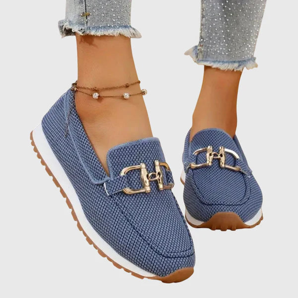 Blue women's comfort slip-on loafers with gold buckle detail and textured fabric upper