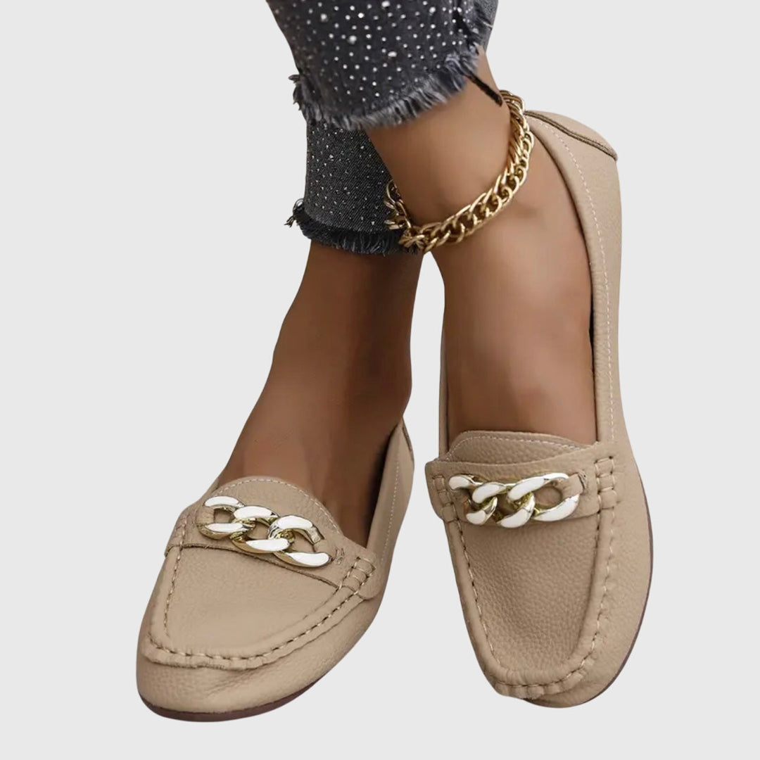 Beige chain loafers with braided chain ornament and low slip-on wedge sole