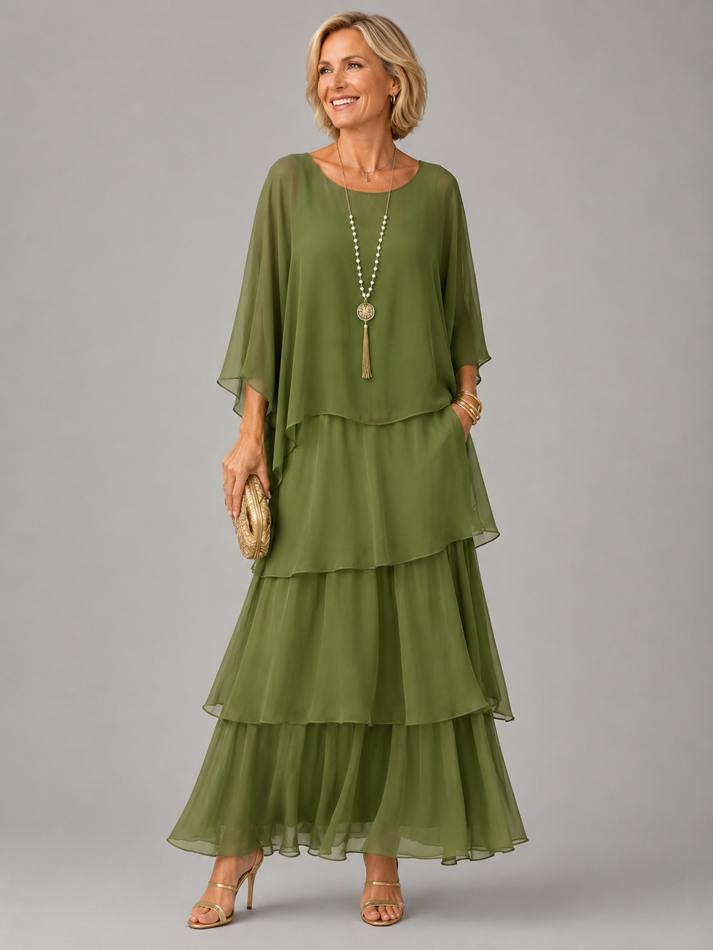 Green tiered maxi dress with chiffon-like overlay sleeves and three-layer skirt