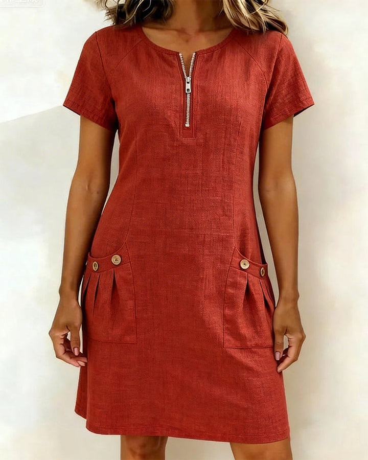 Red casual zip-front dress with short sleeves and two front pocket details