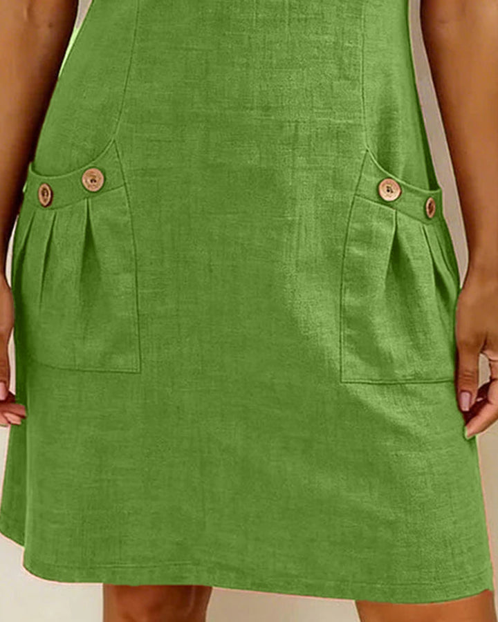 Green casual zip-pocket dress with short sleeves, half-zip, and side buttoned pockets