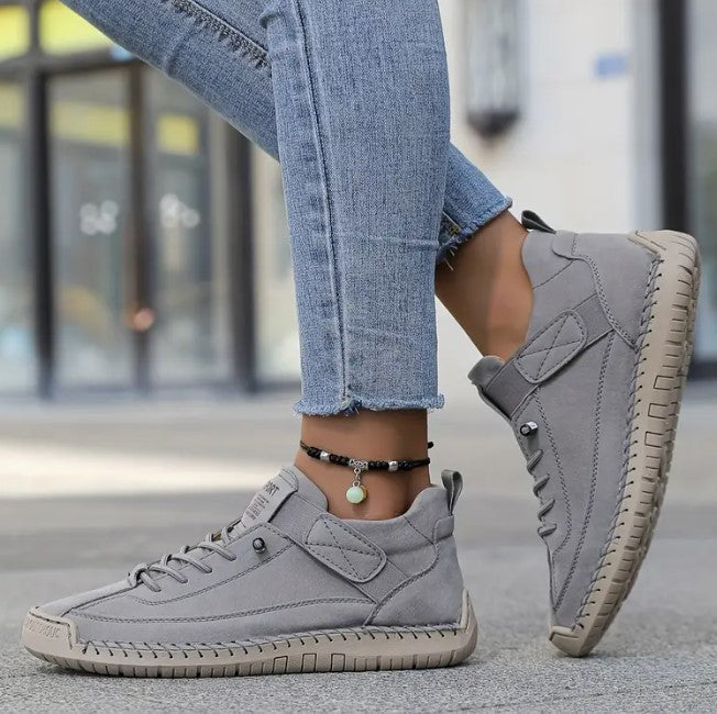 Gray low-top sneakers with quilted panel and cushioned midsole