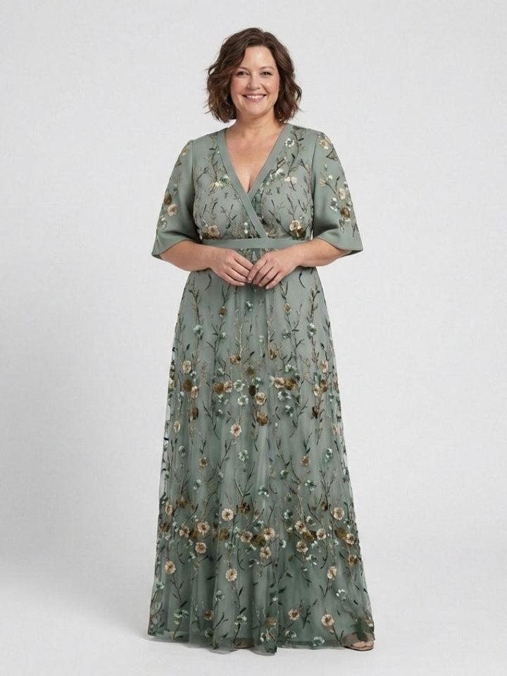 Green floral V-neck short-sleeve maxi dress with cinched waist and long flowing skirt