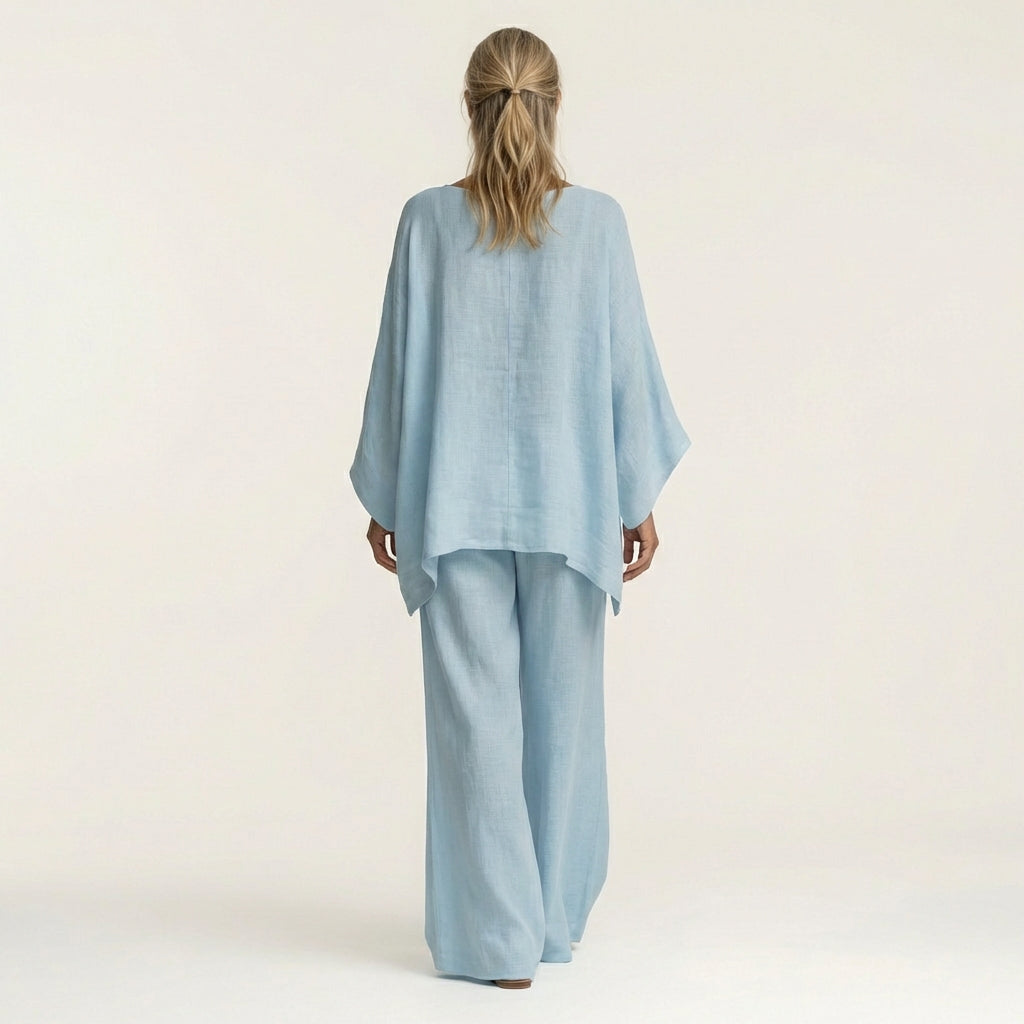Light blue back view linen-blend boho set: draped dolman blouse and wide-leg pants