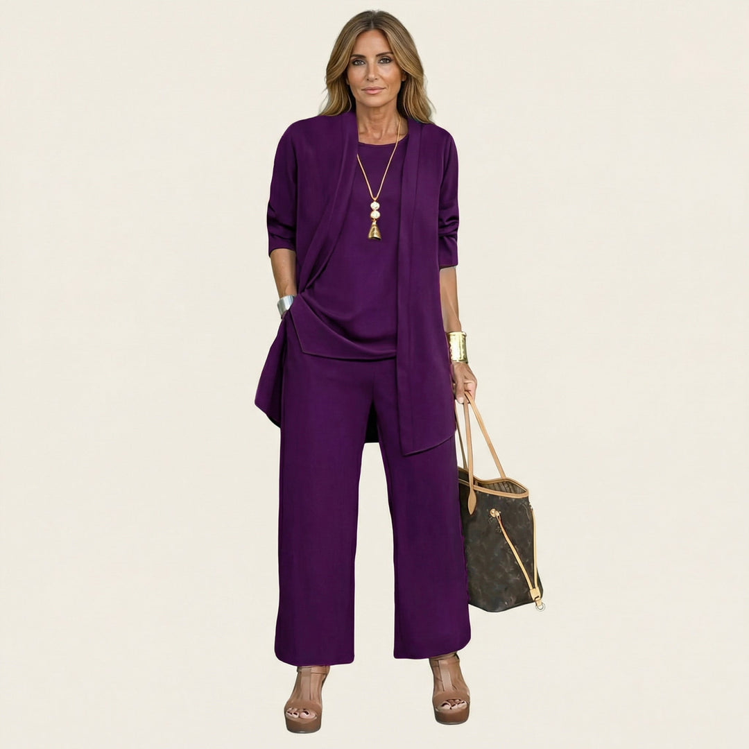 Wine red minimalist 3-piece set with tunic jacket, draped top, and wide-leg pants.