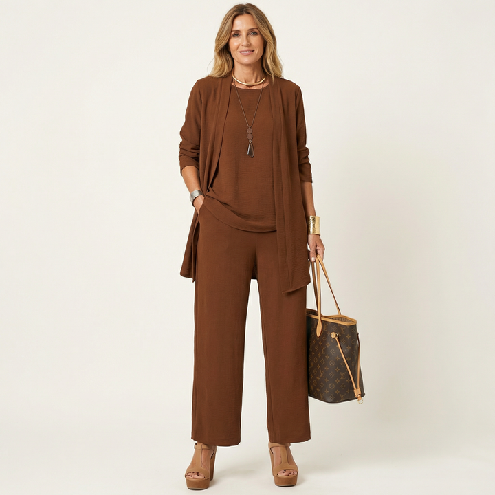 Brown minimalist 3-piece set with tunic jacket, draped top, and wide-leg pants.
