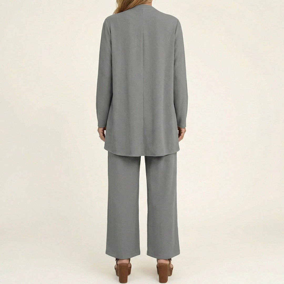 Gray minimalist 3-piece set, back view: long tunic jacket and wide-leg pants.