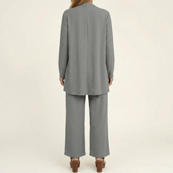Gray minimalist 3-piece set, back view: long tunic jacket and wide-leg pants.