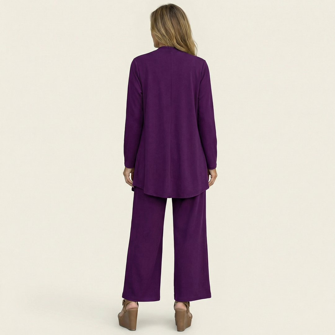 Wine red minimalist 3-piece set, back view: long tunic jacket and wide-leg pants.