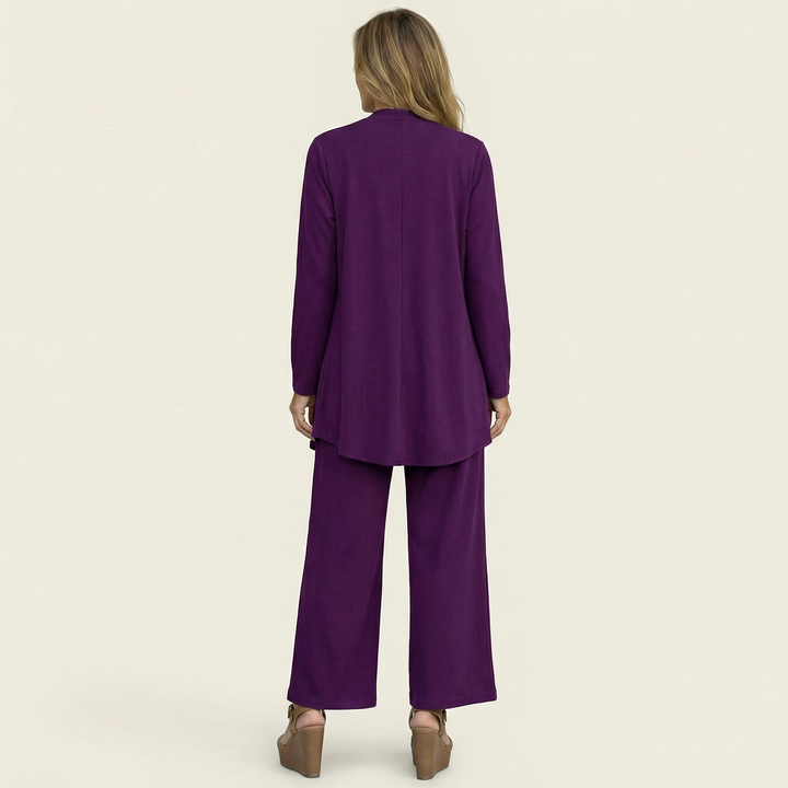 Wine red minimalist 3-piece set, back view: long tunic jacket and wide-leg pants.