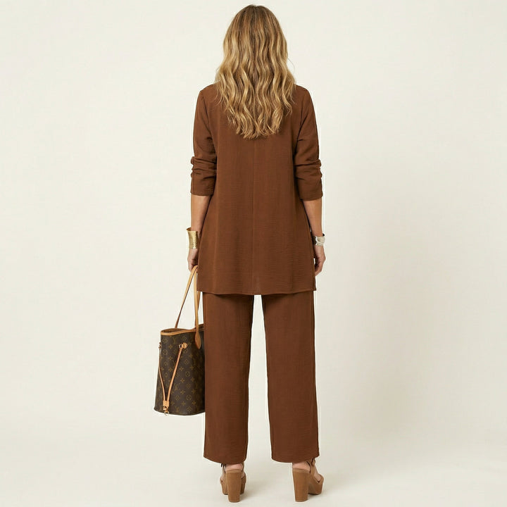 Brown minimalist 3-piece set, back view: long tunic jacket and wide-leg pants.