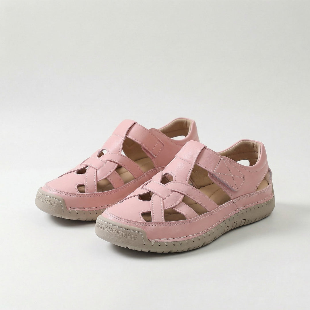 Pink cross-strap comfort flat sandals with cutout upper and cushioned sole