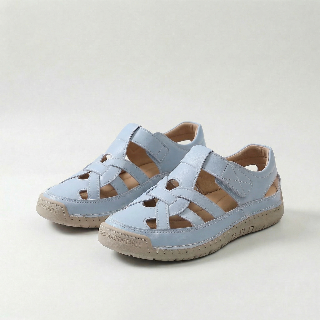 Light blue cross-strap comfort flat sandals with adjustable buckle straps