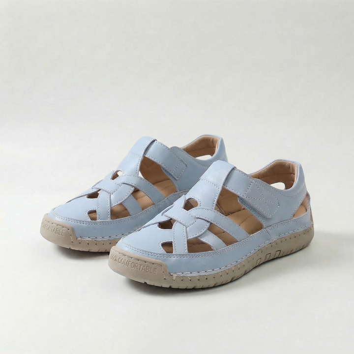 Light blue cross-strap comfort flat sandals with adjustable buckle straps