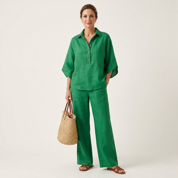 Green linen two-piece set with button-front blouse and wide-leg trousers