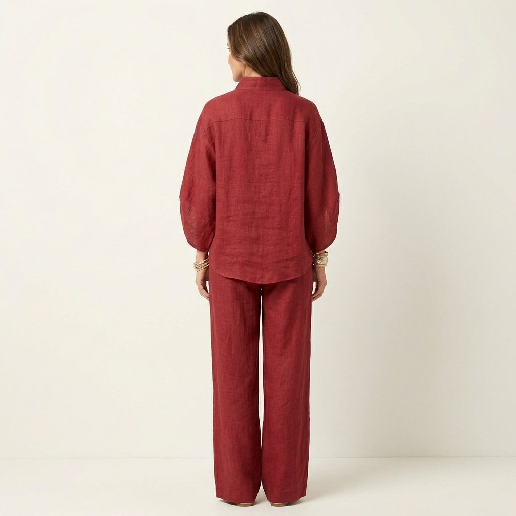 Burgundy linen two-piece set, back view of button-front blouse and wide-leg pants