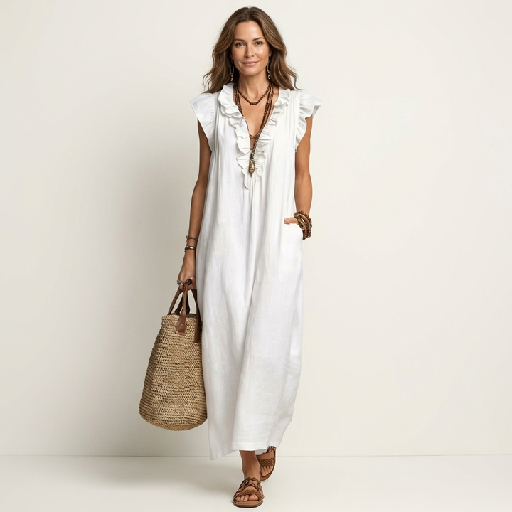 White linen maxi dress with ruffle V-neck and sleeveless styling