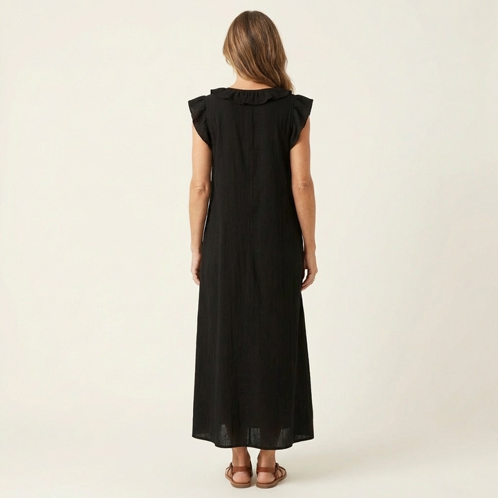 Black linen maxi dress, back view, ruffle-trimmed yoke and cap sleeves