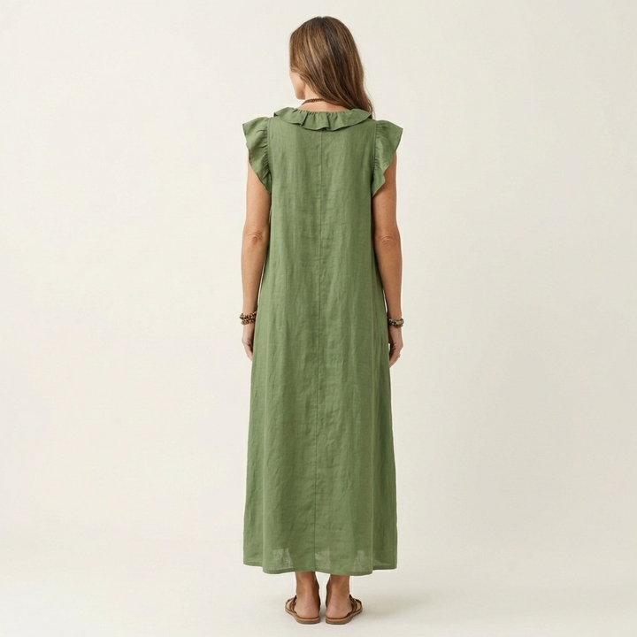 Green linen maxi dress, back view, ruffle-trimmed yoke and cap sleeves