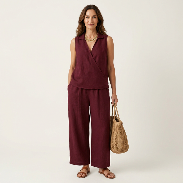 Burgundy sleeveless wrap-top and wide-leg pants set with draped wrap front
