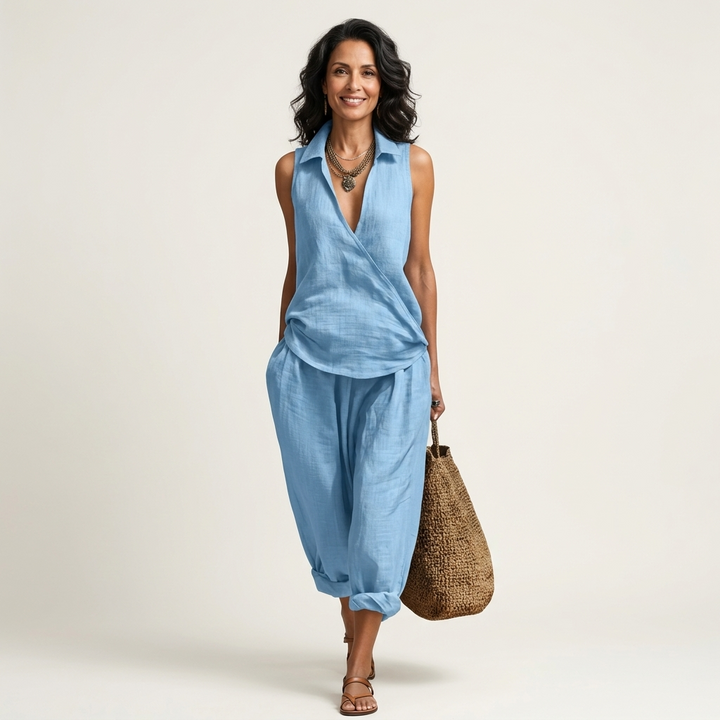 Light blue sleeveless wrap-top and wide-leg pants set with draped wrap front