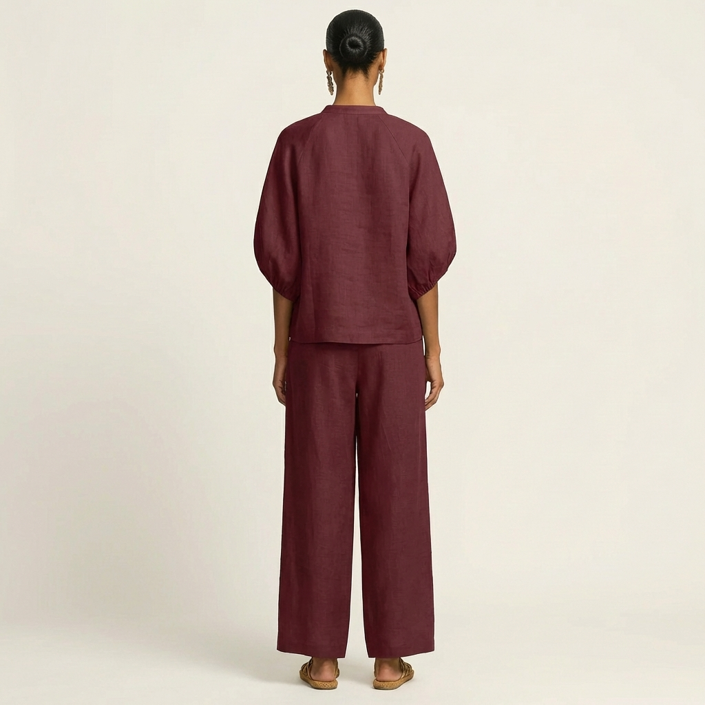 Burgundy back view zip-front puff sleeve top with wide-leg pants, elastic waist
