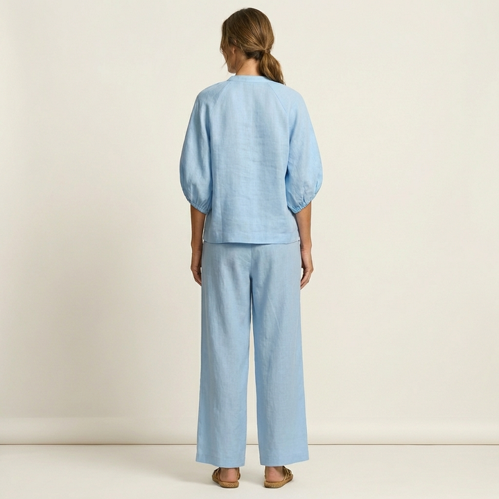Light blue zipper-front puff sleeve top and wide-leg pants set, back view