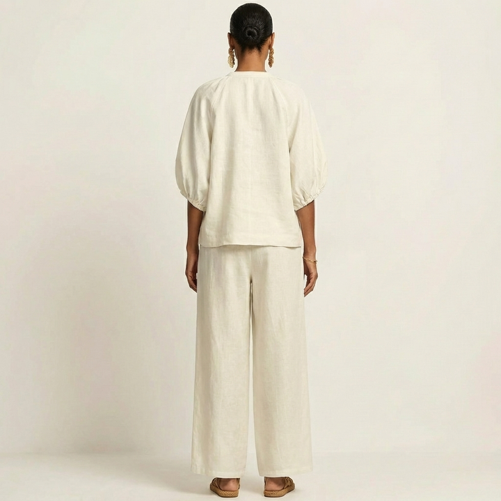White zipper-front puff sleeve top and wide-leg pants set, back view