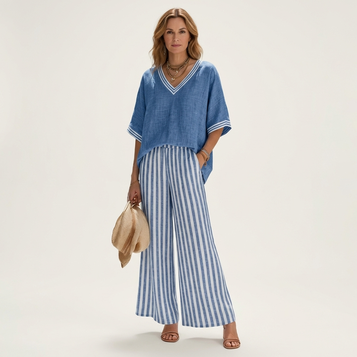Blue V-neck varsity top with striped wide-leg pants in blue and white