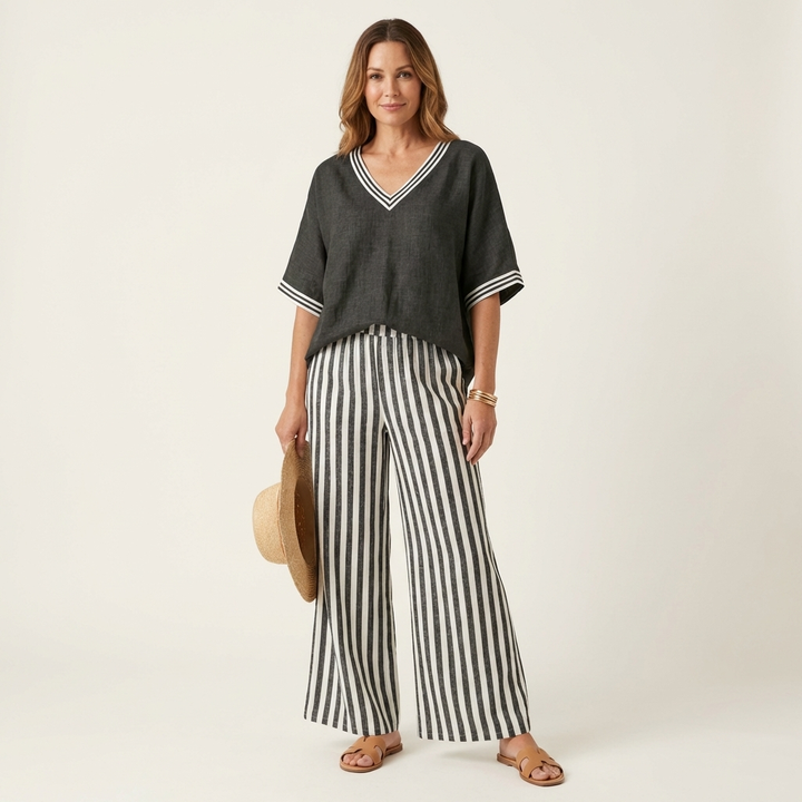 Dark gray V-neck varsity top with striped wide-leg pants in dark gray and white