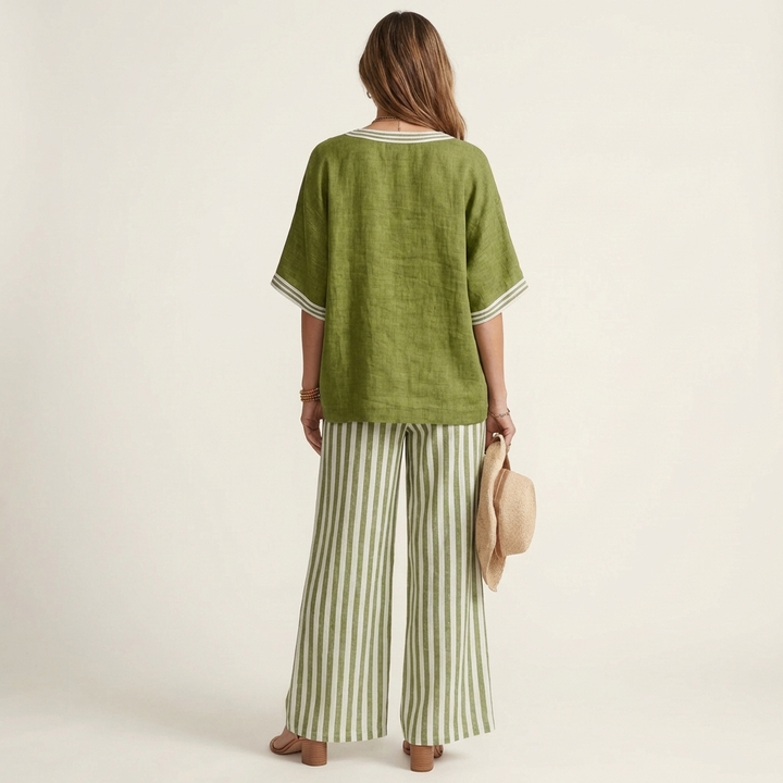 Back view: green V-neck varsity top with striped wide-leg pants in green and white