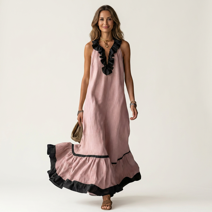 Pink sleeveless maxi dress with ruffle neckline and black contrast trim
