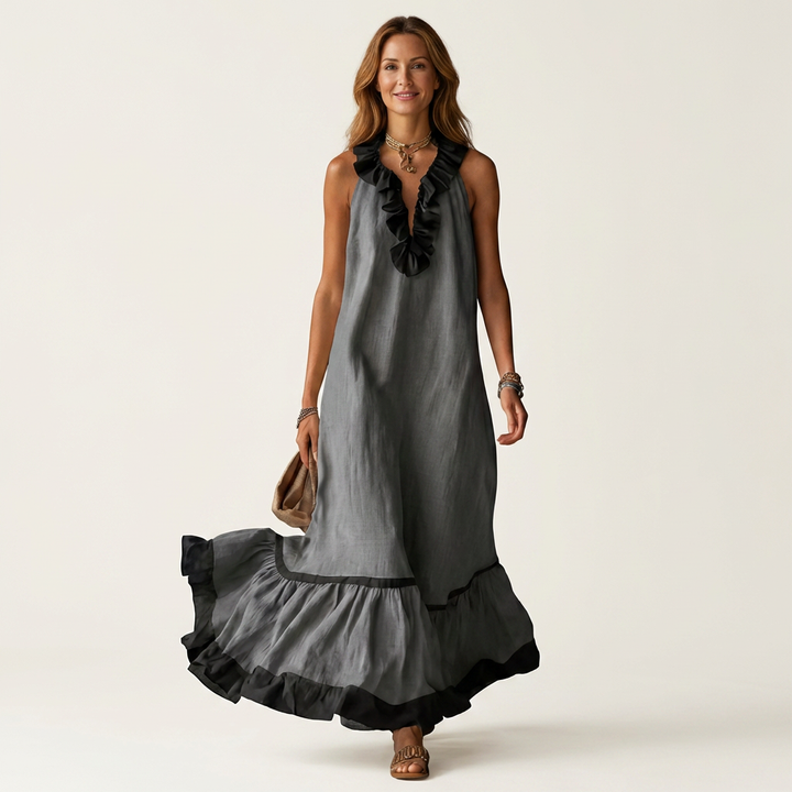 Dark gray sleeveless maxi dress with ruffle neckline and black contrast trim