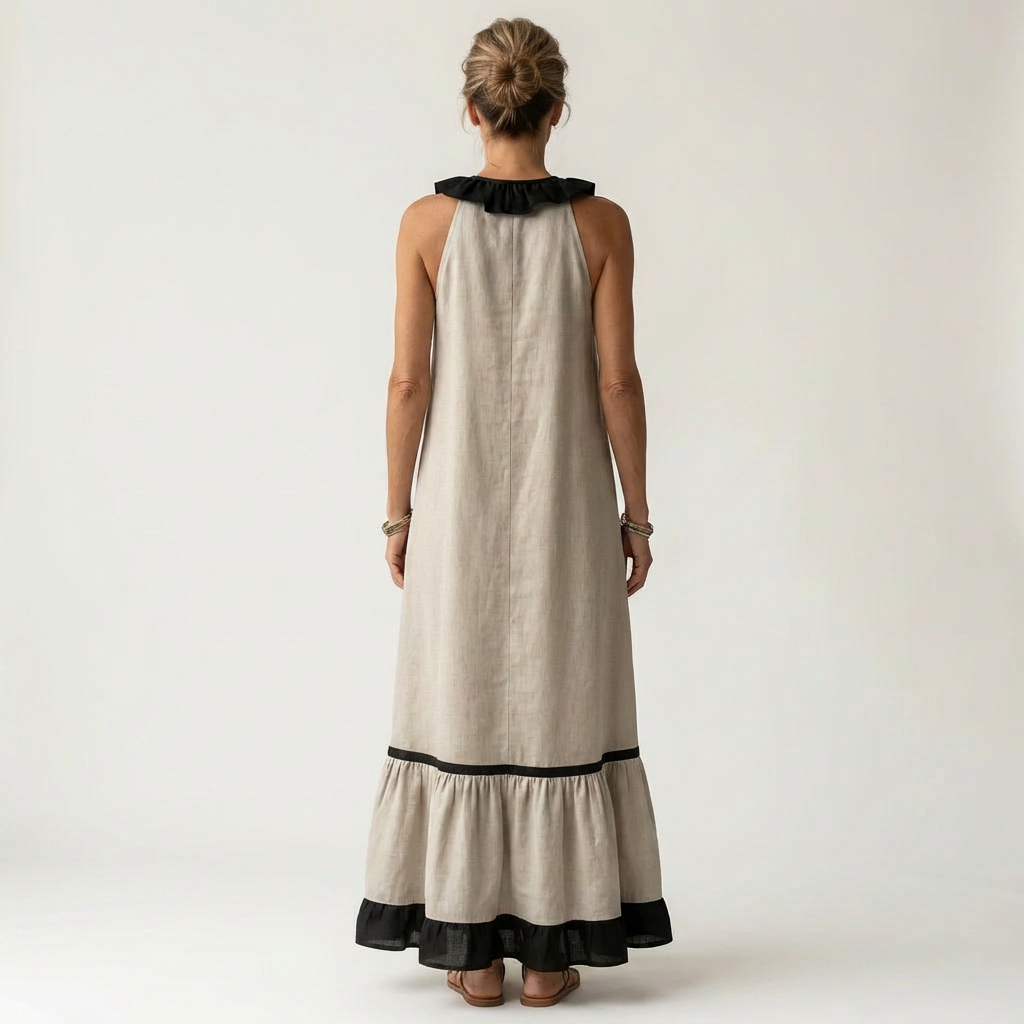 Sleeveless maxi dress back view, white with black ruffle neckline and contrast hem