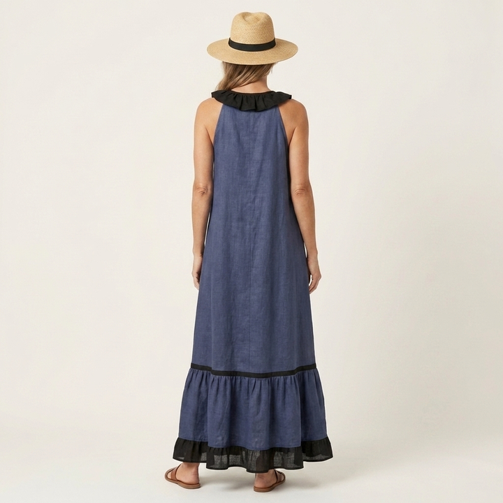 Blue sleeveless maxi dress, back view with ruffle neckline and black contrast hem trim