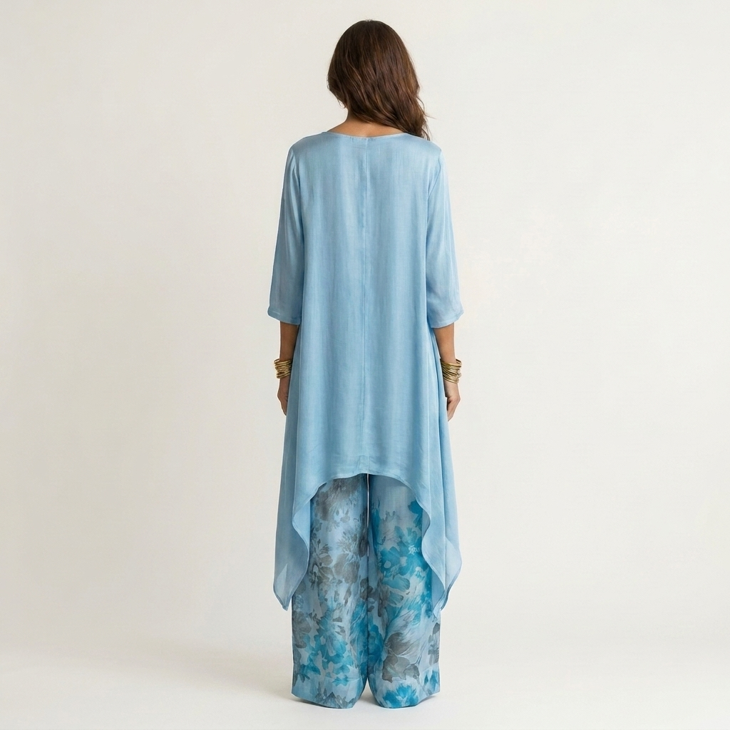 Blue cotton-silk two-piece set, back view tunic with draped asymmetric hem and floral pants