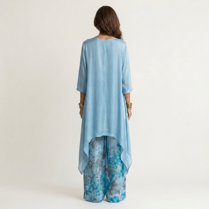 Blue cotton-silk two-piece set, back view tunic with draped asymmetric hem and floral pants