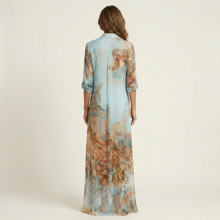 Blue silk maxi shirt dress, back view with V-shaped yoke and paisley print