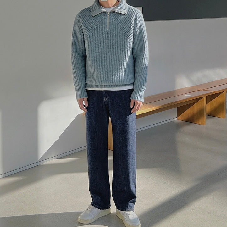 Light blue quarter-zip knit pullover sweater with stand collar and long sleeves.