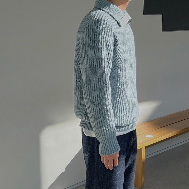 Light blue quarter-zip knit pullover sweater, side view with ribbed cuffs and hem.