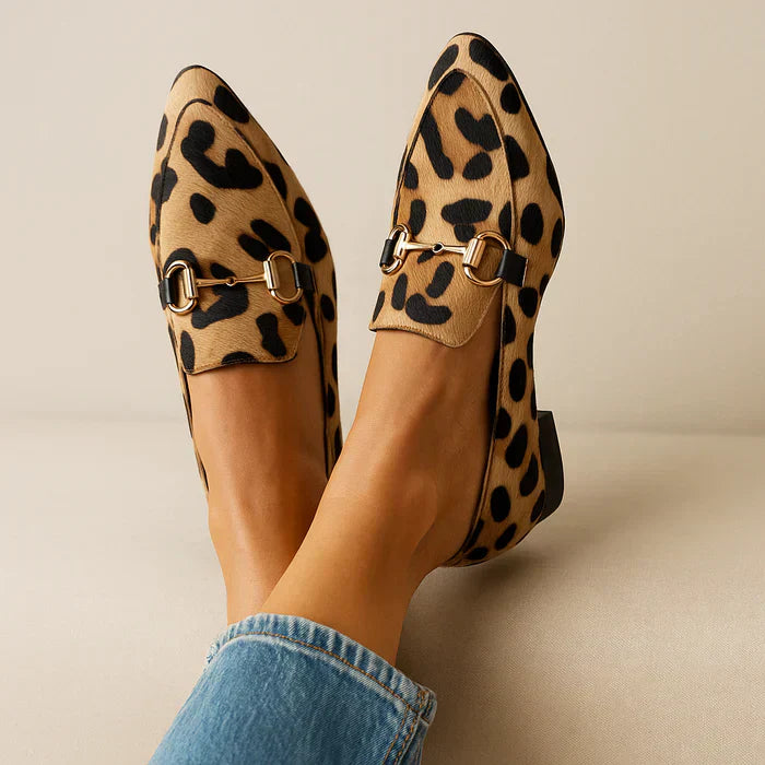 Leopard-print slip-on loafers, side view with curb-style bit strap