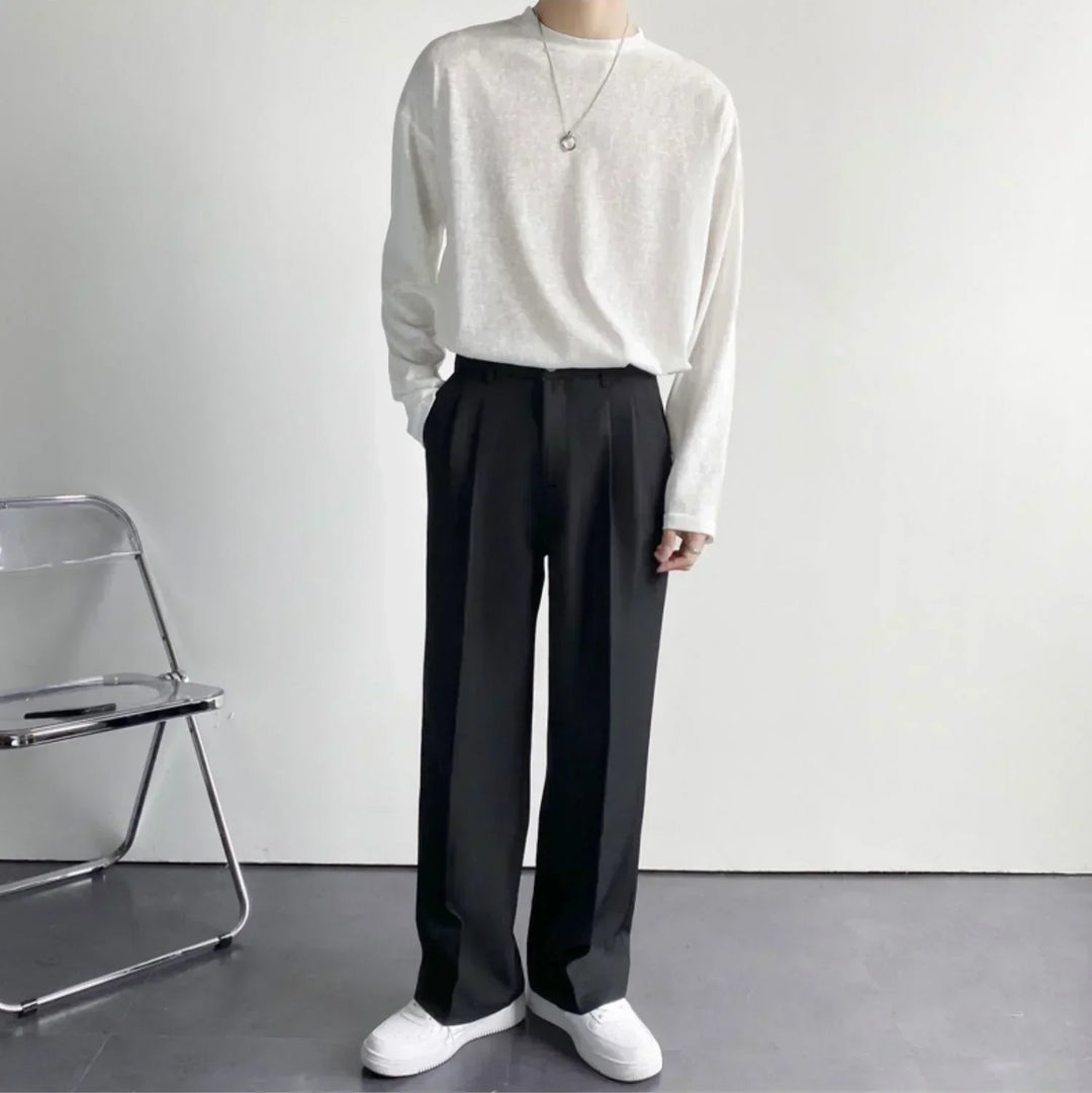 Black pleated wide-leg trousers, full-length front view, relaxed straight legs