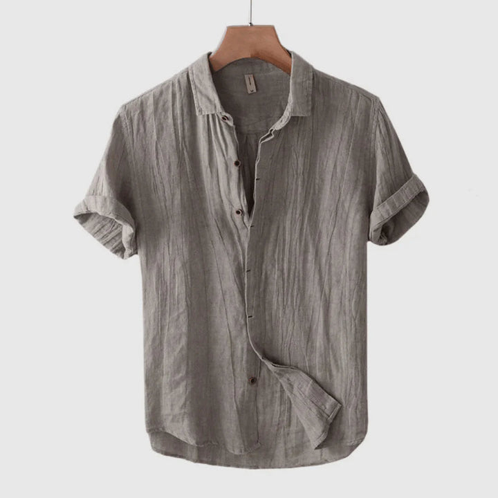 Gray short-sleeve button-up shirt with point collar and button placket