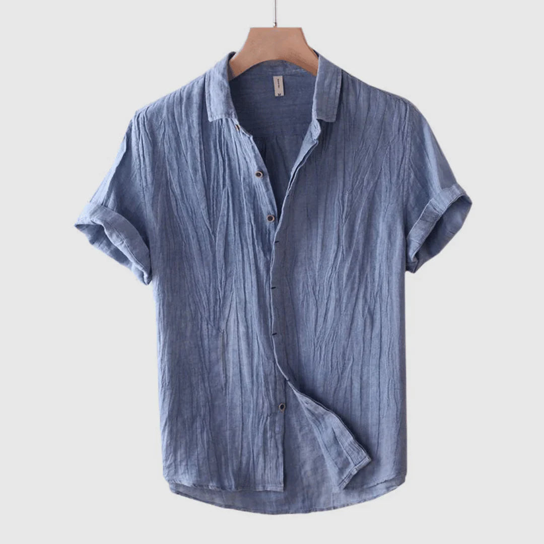 Blue short-sleeve button-up shirt on hanger, point collar, button placket detail