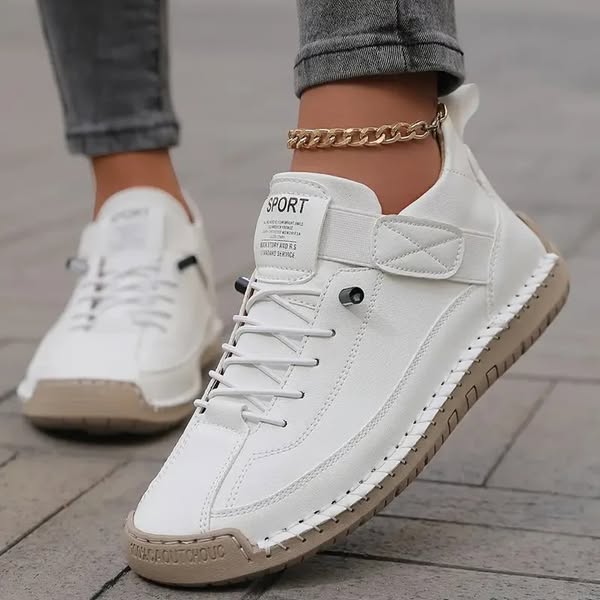 White orthopedic slip-on sneaker with lace-up closure and contrast sole stitching