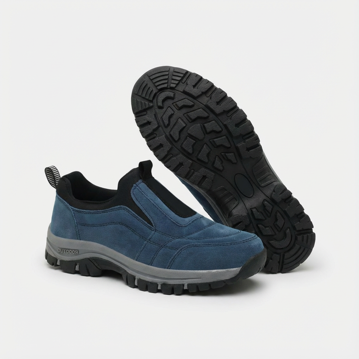 Blue unisex trail slip-on sneaker with black trim and rugged tread sole